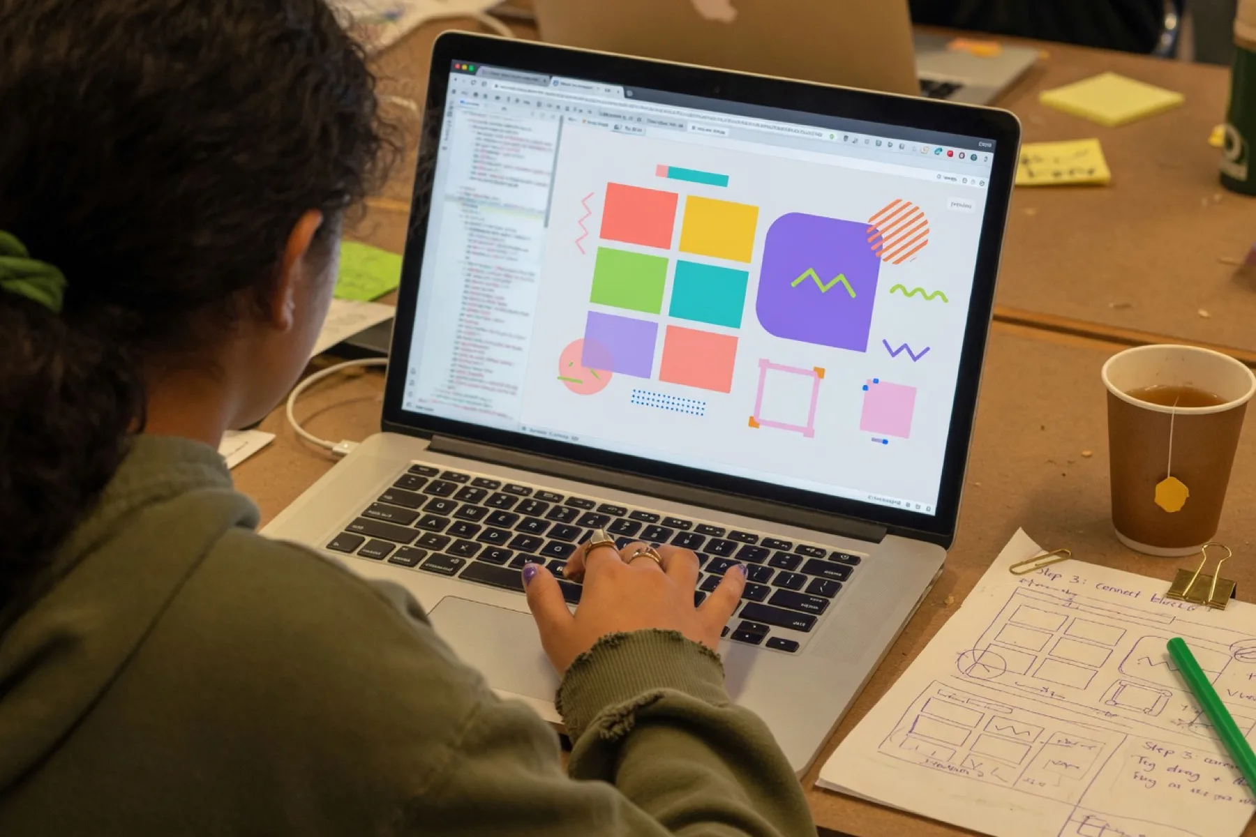 A student building a simple app on a laptop